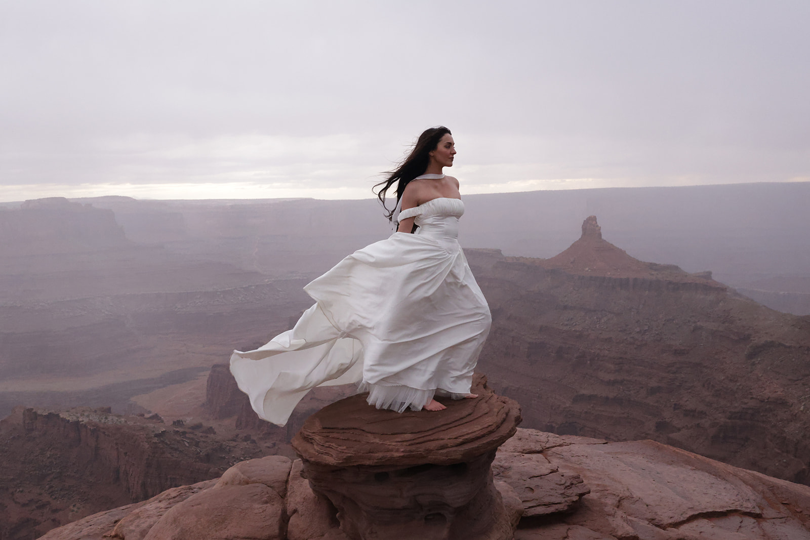Close romantic moment between bride and groom captured during an adventurous desert elopement.